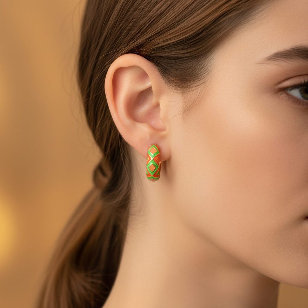 Timmy oil drip huggie earrings - Red Orange enamel geometric hoop earring on ear close-up