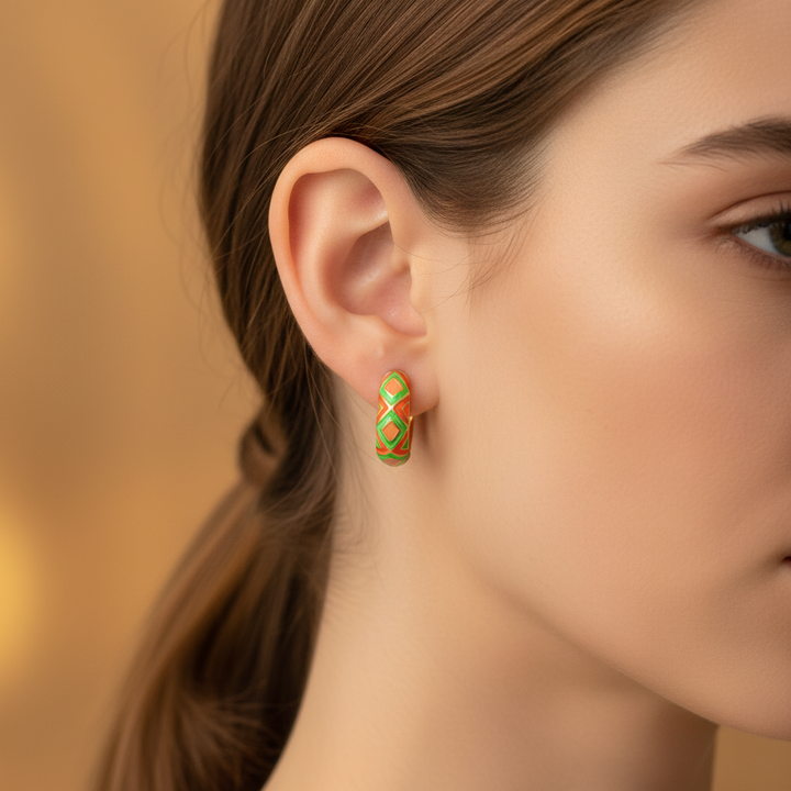 Timmy oil drip huggie earrings - Red Orange enamel geometric hoop earring on ear close-up
