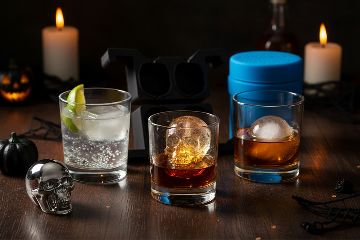 Skull ice cube molds with Halloween cocktails - skull ice in dark rum drinks, moody party atmosphere